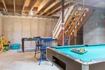 Basement entertainment - Pool table and seating for spectators